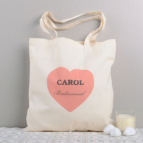 Bolsas de algodón para damas de honor de corazones rosados.